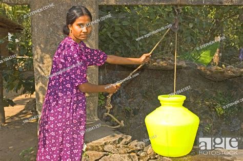 India Kerala Periyar Girl Collecting Water At The Well
