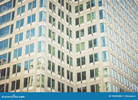 Tall Office Building With A Lot Of Windows Great For Background Or