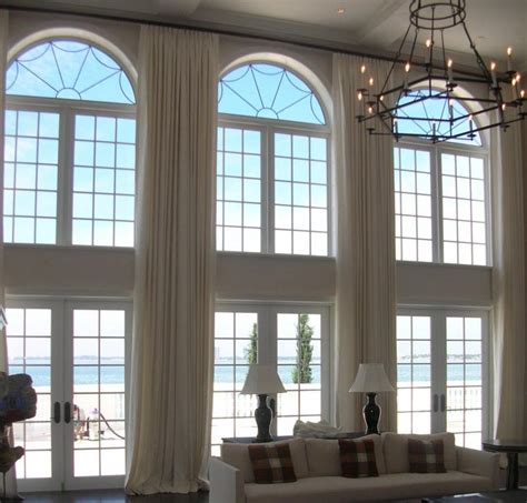 Arched windows may seem difficult to cover, but custom arched window treatments are simple and beautiful. Window Treatment Ideas for Arched Windows | Aria On-Site