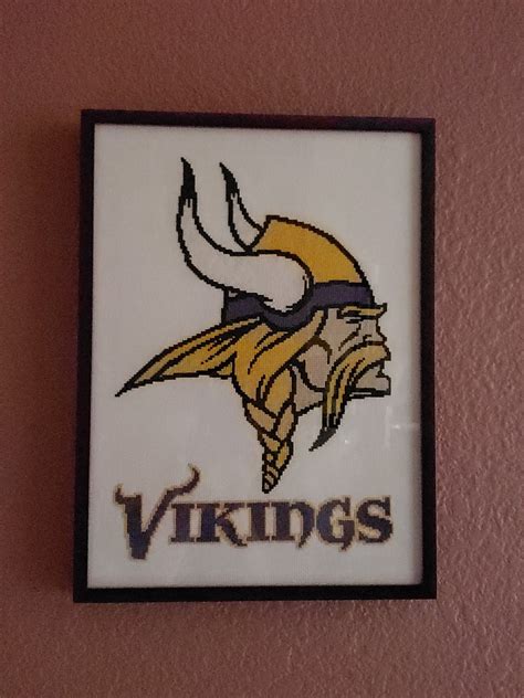 It would be perfect hanging in a little boy's room, or as a throw pillow for a bed or sofa. EASY PATTERNS: Minnesota Vikings cross-stitch pattern