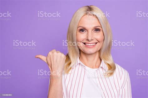 Photo Of Pretty Nice Mature Woman Dressed Pink Shirt Pointing Thumb Up