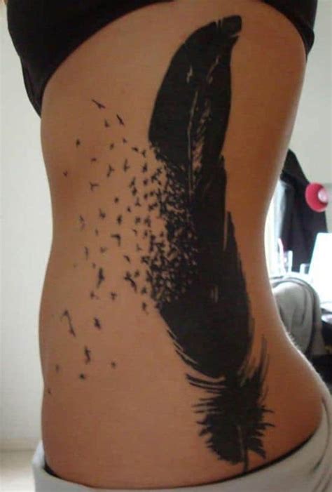 The manta ray in the tribal tattoo is inked in black and white and has a diamond design. 150 Meaningful Feather Tattoos (Ultimate Guide, July 2020)