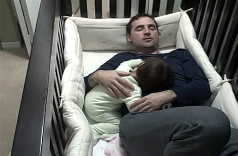 Father Climbs Into Crib To Comfort His Crying Daughter