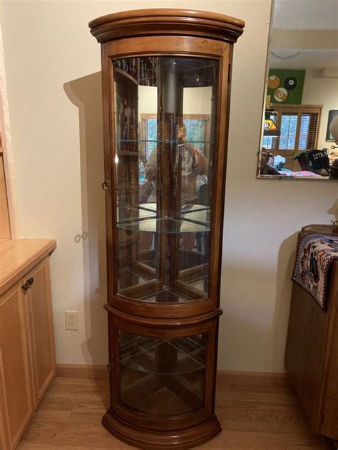 Celebrate your collections in this clean, contemporary curio cabinet! Pulaski Corner curved display curio cabinet for Sale in ...