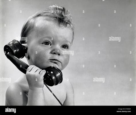 Vintage photo of baby boy talking on phone Stock Photo - Alamy