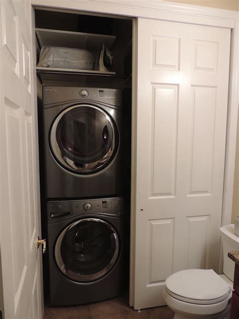 After - stackable washer and dryer with little storage above | Laundry