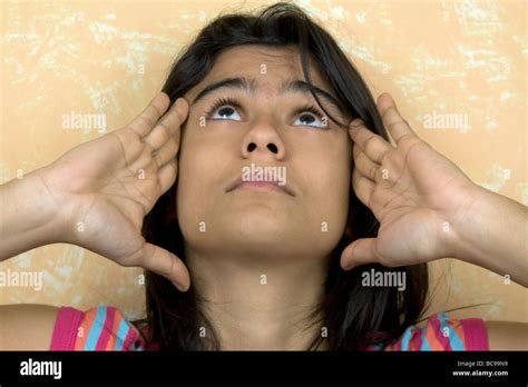 Close Up Of A Teenage Girl Rubbing Her Temples Stock Photo Alamy