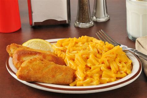 Fish Sticks With Macaroni And Cheese Stock Image Image Of Glass