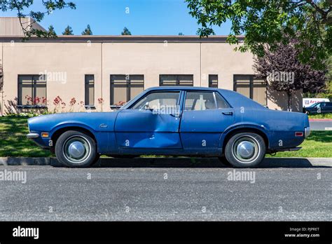 Battered Blue Mercury Comet Car Parked On Street Sunnyvale