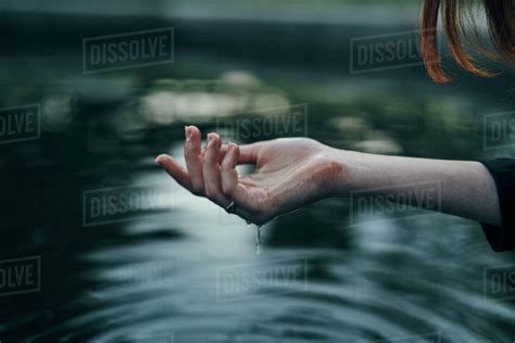 Water Dripping From Hand Of Woman Stock Photo Dissolve