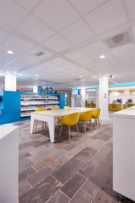 The Yellow Beso Chairs Brighten Up This Library Beso Designer