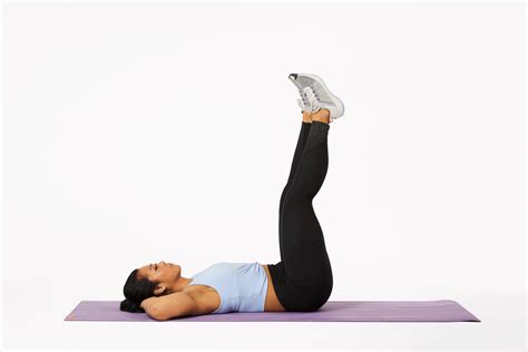 A Woman Is Doing An Exercise On Her Stomach