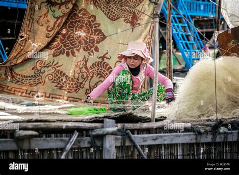 Cambodian Woman Mending Fishing Net Kampong Phluk Floating Village