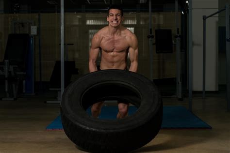 Premium Photo Crossfit Workout By Doing A Tire Flip
