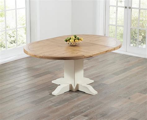 The tables will perfectly fit any party's size. Torino Oak & Cream Extending Dining Table | Round wooden ...