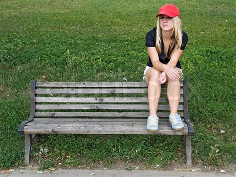 Girl Sitting Down On Bench