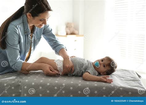 Mother Changing Baby`s Diaper On Table Stock Image Image Of Care