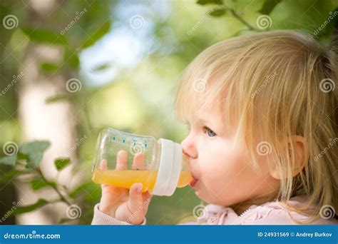 Adorable Baby Drinking Juice With Bottle Stock Image Image Of Healthy