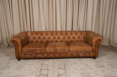 The history of the chesterfield sofa is long and storied: Brown Leather Chesterfield Sofa | Randal Events