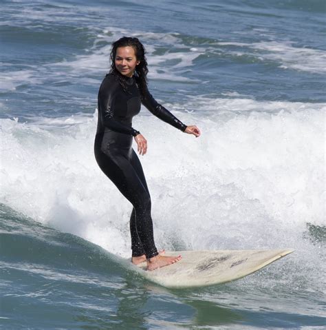 surfer girl in wetsuit having fun nathan rupert flickr