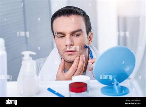 Gorgeous Concentrated Man Applying Razor Stock Photo Alamy