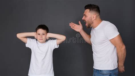 Nervous Father Screaming At Son Boy Closing Ears Stock Photo Image