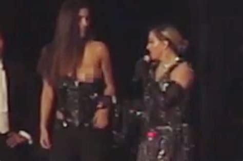 madonna pulls down female fan s top at concert page six