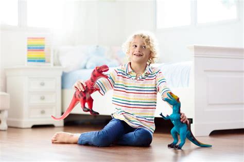 Child Playing With Toy Dinosaurs Kids Toys Stock Image Image Of