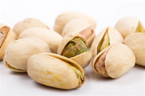 Several Pistachio Nuts Naked And In Shell Close Up Stock Photo Image