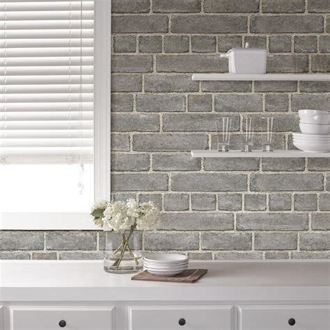 The distressed wood pattern gives the look of reclaimed materials while the cool toned color palette adds a modern touch. NuWallpaper Grey Brick Facade Peel and Stick Wallpaper ...