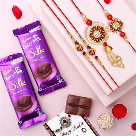 TIED RIBBONS Rakhi For Brother And Bhabhi With Chocolates Gift