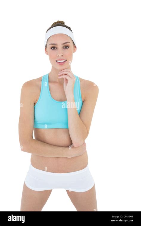 Cute Slender Woman Posing In Sportswear Looking At Camera Stock Photo