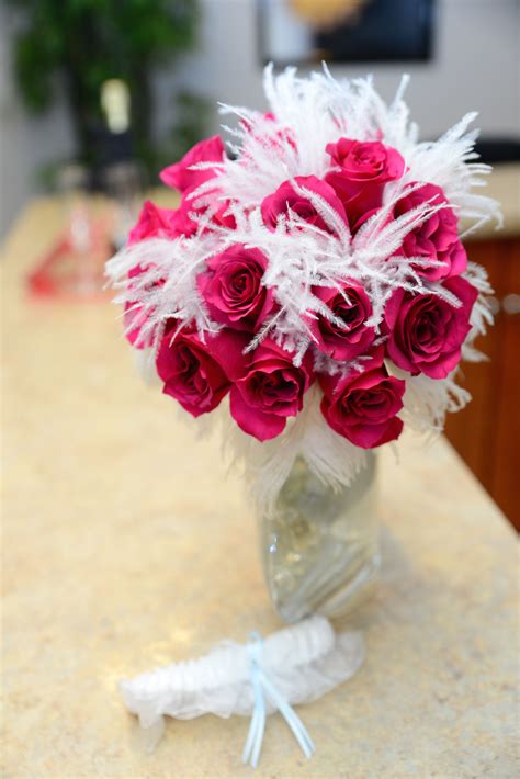 Maybe you would like to learn more about one of these? Unique and funky feather and rose bouquet by the Chapel at ...