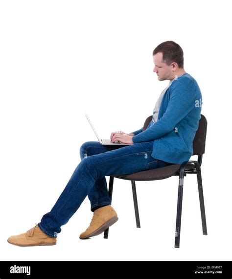 Side View Of A Man Sitting On A Chair To Study With A Laptop Isolated