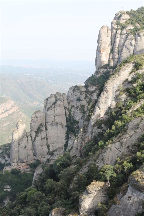 The Mountains Are Covered With Trees And Rock Formations