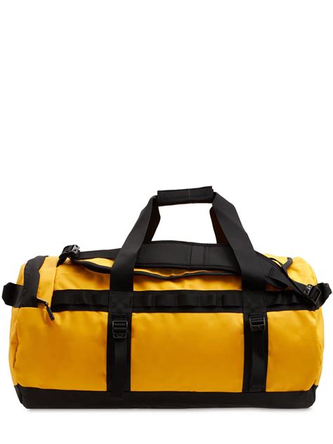 The North Face Base Camp Small 50l Duffel Bag In Yellow Modesens