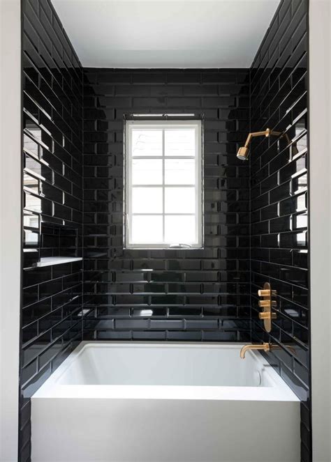 Modern bathroom pictures and photos for your next decorating project. Black subway tile creates bold contrast against the bright ...