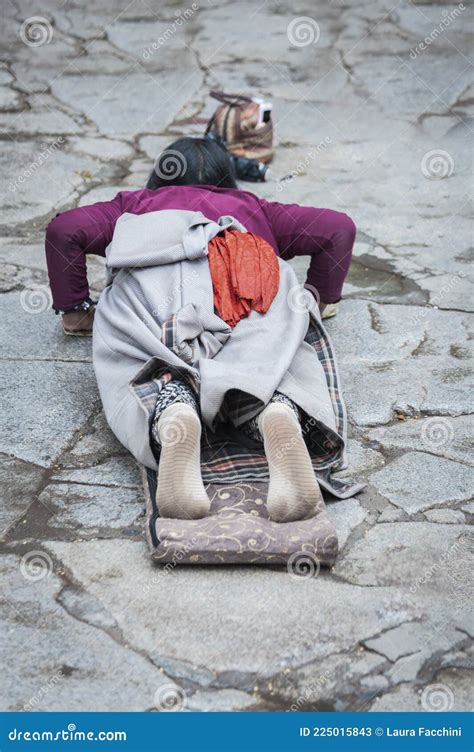Female Pilgrim Lying On The Floor After Prostrating Herself Editorial Image