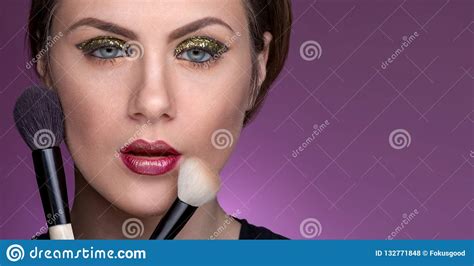 Girl Holding Cosmetic Brushes To Her Face Stock Photo Image Of Female