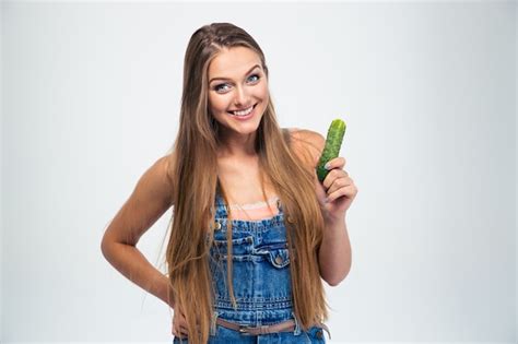 Premium Photo Portrait Of A Smiling Girl Holding Cucumber