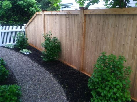 6' high universal tongue and groove cedar board fence.