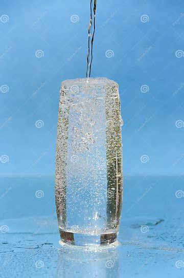 A Stream Of Mineral Water Pouring Into A Glass Stock Image Image Of