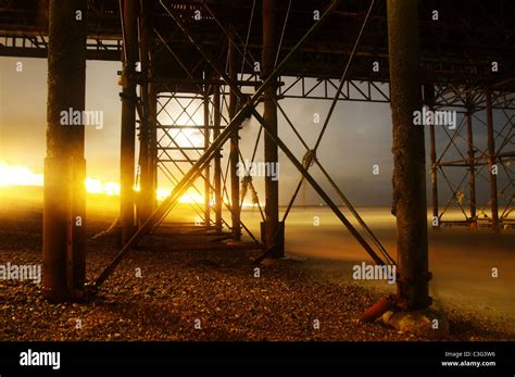 Long Exposure Night Shot Of The Scaffolding Under Brighton Pier Stock