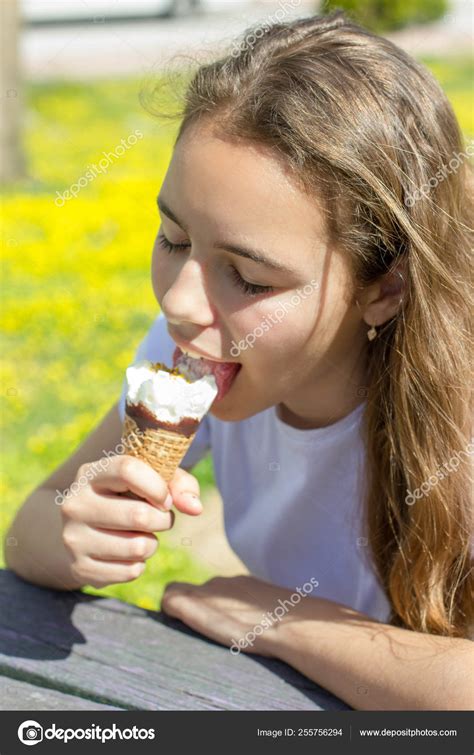 Beautiful Teen Girl Eating Ice Cream In A Waffle Cone In Summer Selective Focus Stock Photo By