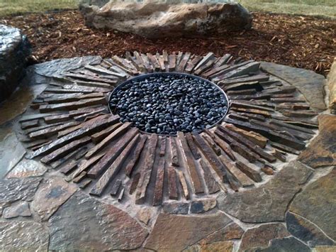 A fire pit is a wonderful addition to an outdoor living space design. In-Ground Fire Pit: Risks and Tips - HomesFeed