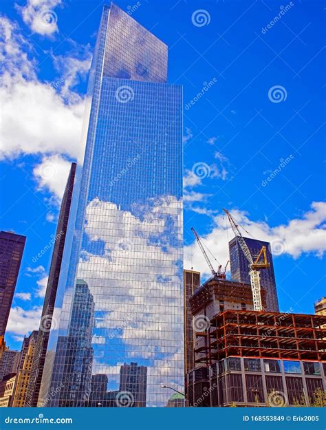 Construction Site With Blue Sky And Clouds Reflection In Windows Of