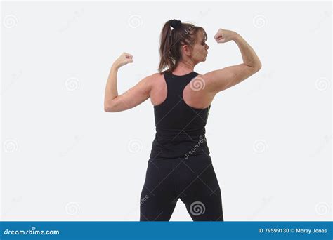 Attractive Middle Aged Woman In Sports Gear With Her Back To The Camera