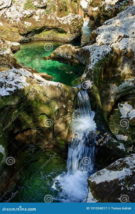 Emerald Blue Mountain River With Crystal Clear Water Flowing Through
