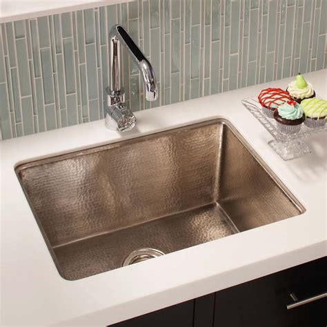 The countertop runs to the edge, and the sink starts from the bottom of the sink. Cocina 24-Inch Copper Kitchen Sink | Native Trails
