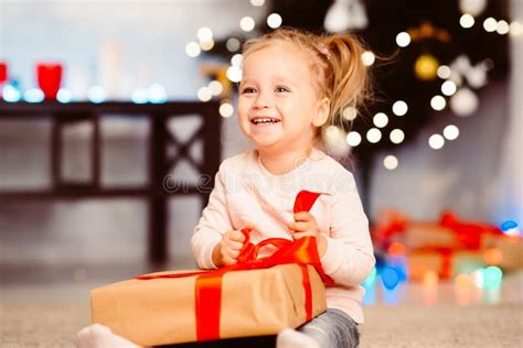 Cute Little Girl Opening Christmas T At Home Stock Image Image Of